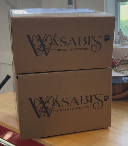 Two Wasabi’s branded shipping boxes